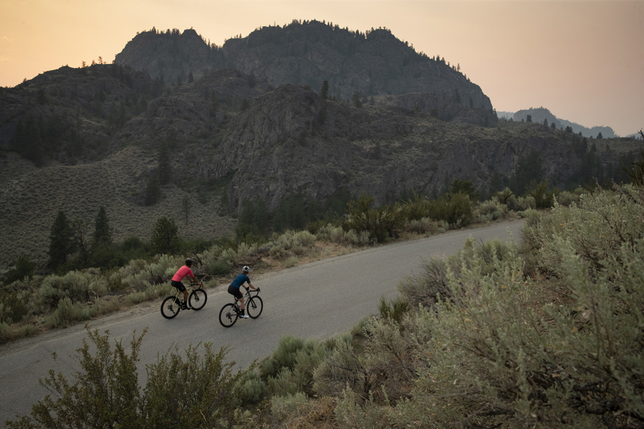 Riding a road up a steep hill in the woods